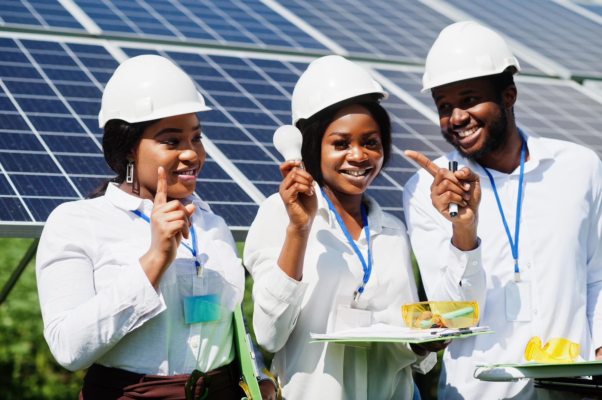 African solar innovators working together at an energy site